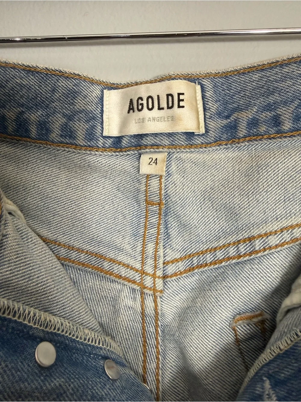 13. AGOLDE Light Wash Distressed High-Rise Denim Shorts - Parker Long